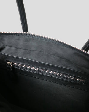 Open interior of Cila handmade leather bag – spacious main compartment with suede fabric lining