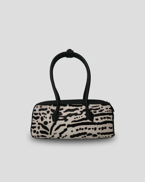 Cila Cow Print genuine leather handbag in Wild Stripe – graphic black and cream cowhide pattern