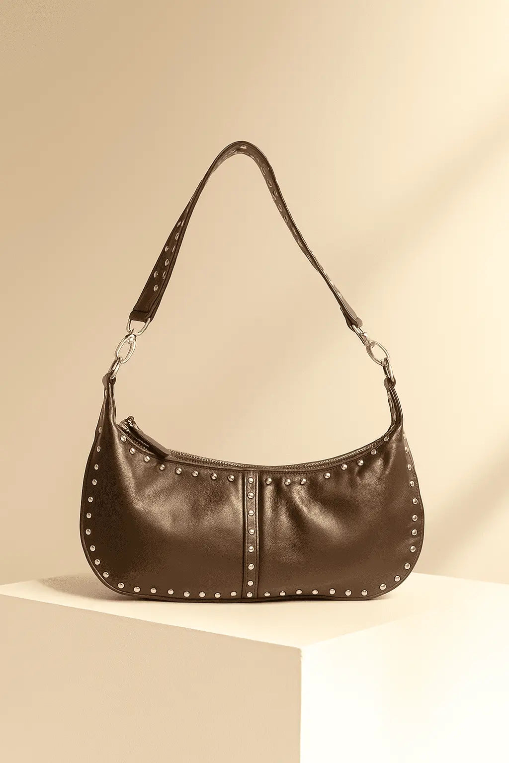 Brown shoulderbag with studded details on a photo studio canggu bali