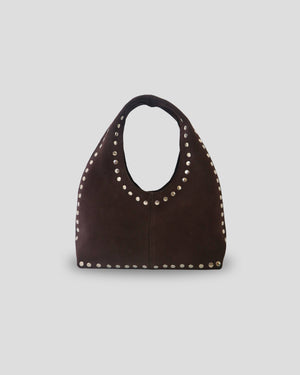 Woman wearing handcrafted Bali leather shoulder bag - stylish Indonesian artisan accessory