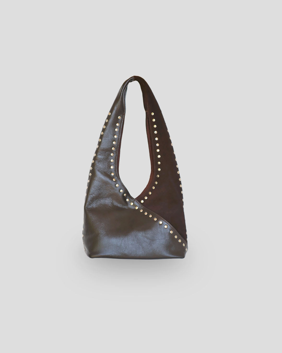 Brown mariposa leather handbag with studs on a light gray background