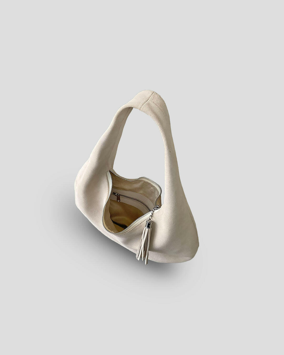 Olia suede bag tassel detail French style accent how to care for suede bags