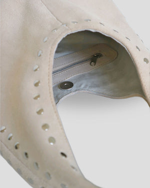 Close-up silver stud accents on genuine Bali leather goods showing artisan attention to detail