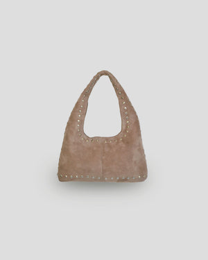 Brown handbag with studded details on a white background