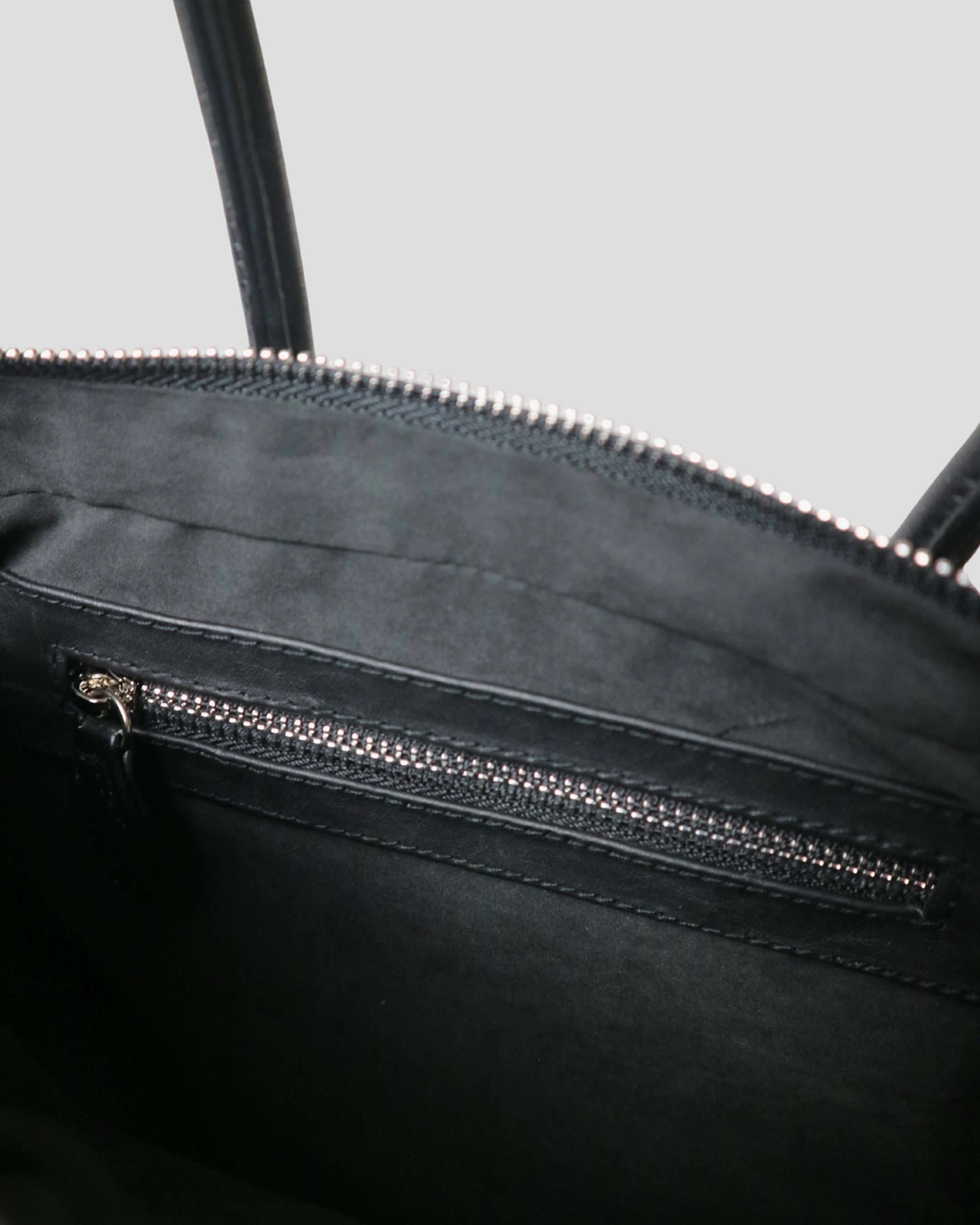 Open interior of Cila handmade leather bag – spacious main compartment with suede fabric lining