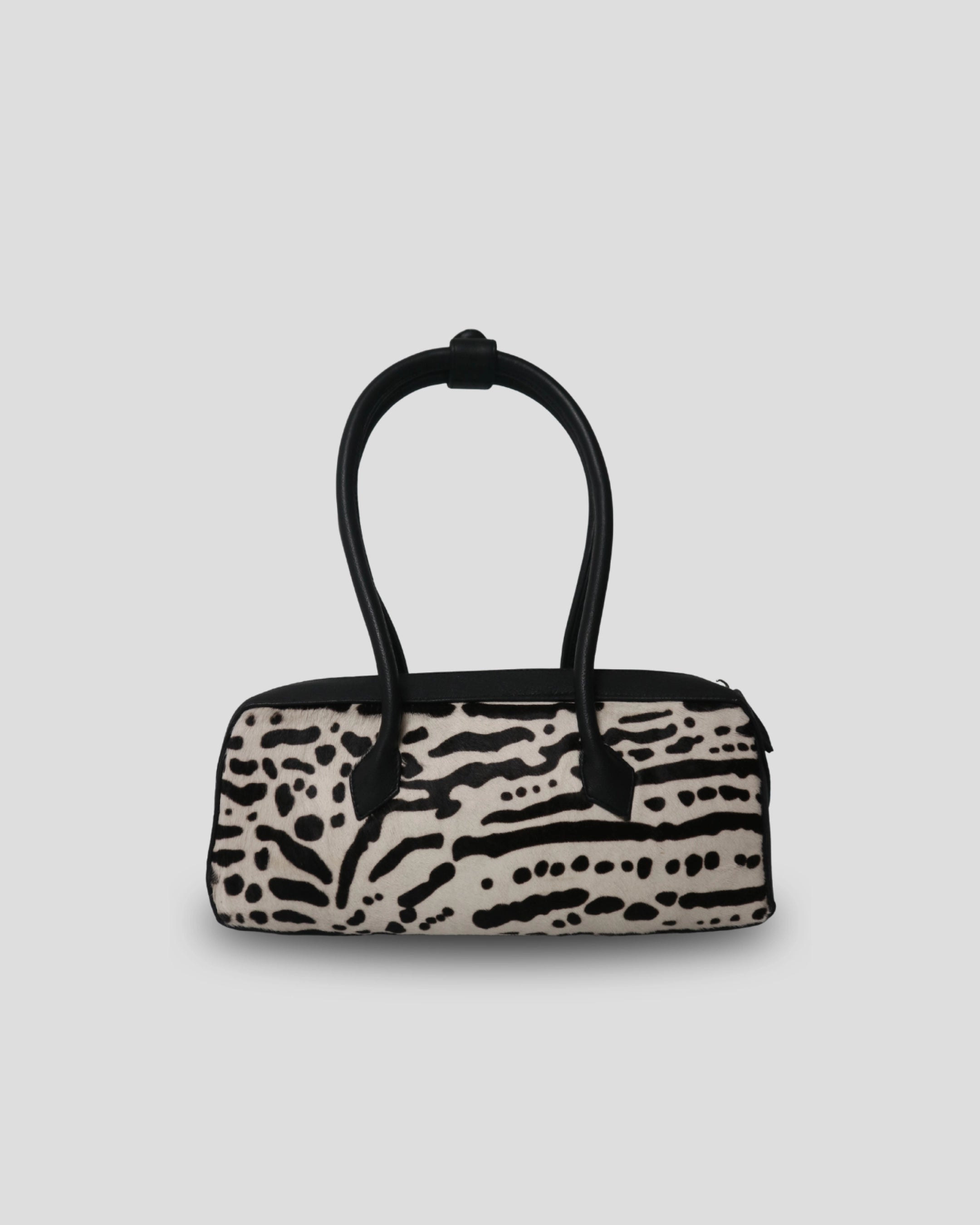 Cila Cow Print genuine leather handbag in Wild Stripe – graphic black and cream cowhide pattern