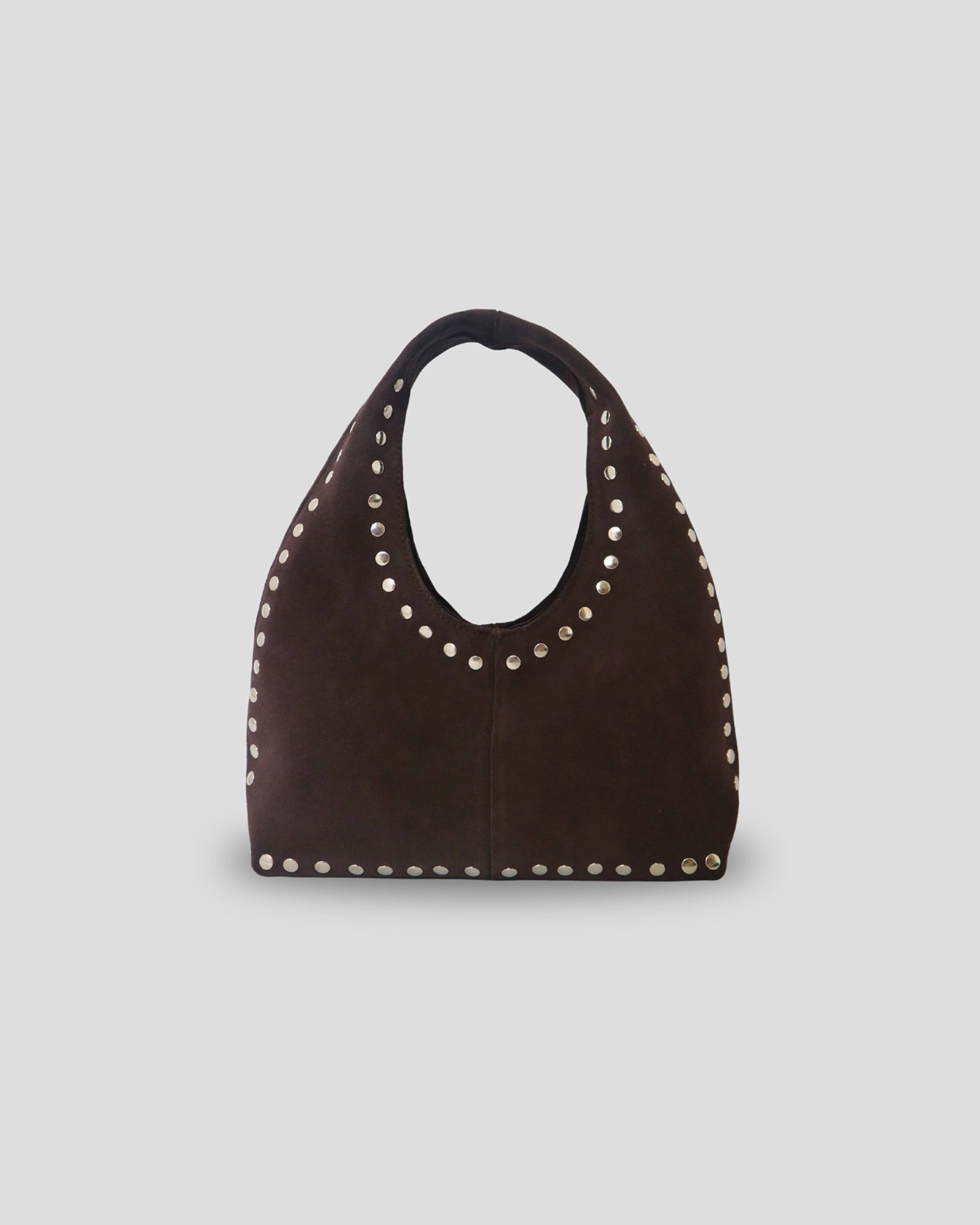 Woman wearing handcrafted Bali leather shoulder bag - stylish Indonesian artisan accessory