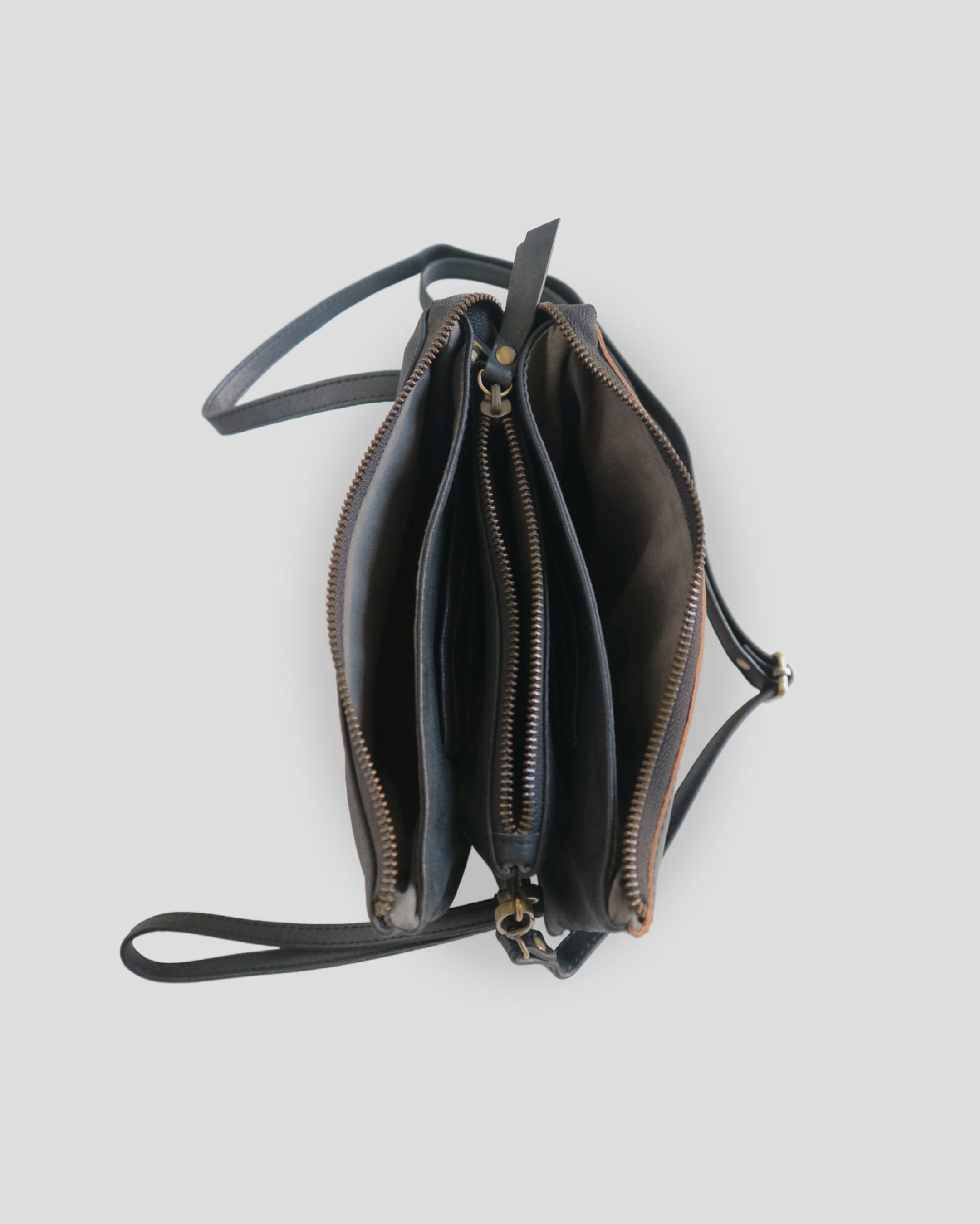 Flo carving sling bag by Nam Leather Bali