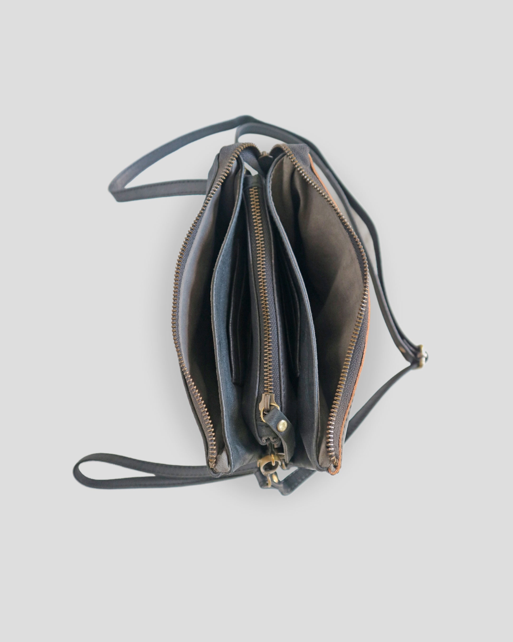 Flo carving sling bag by Nam Leather Bali