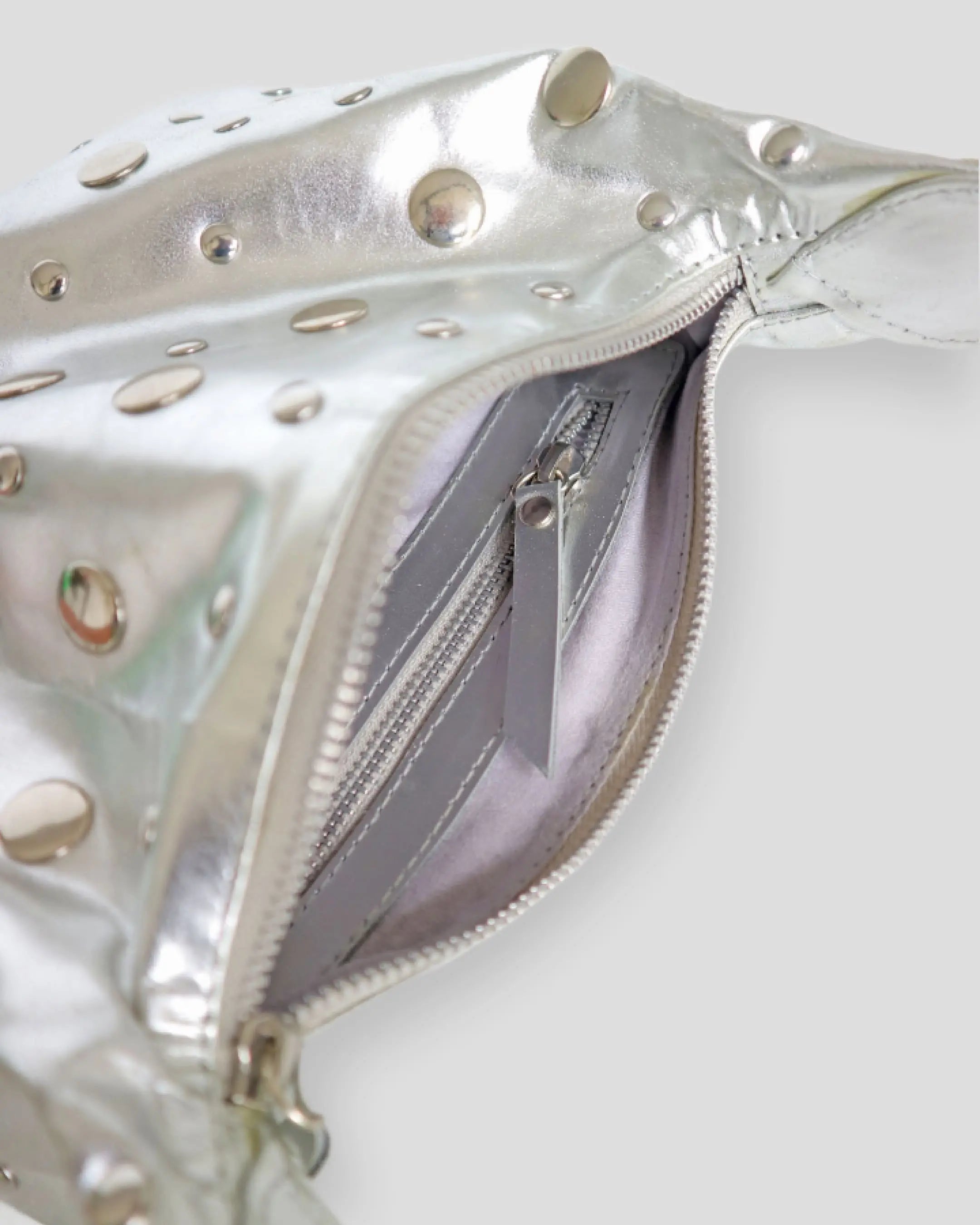 Silver studded shoulder bag for women interior showing zippered pocket and suede lining