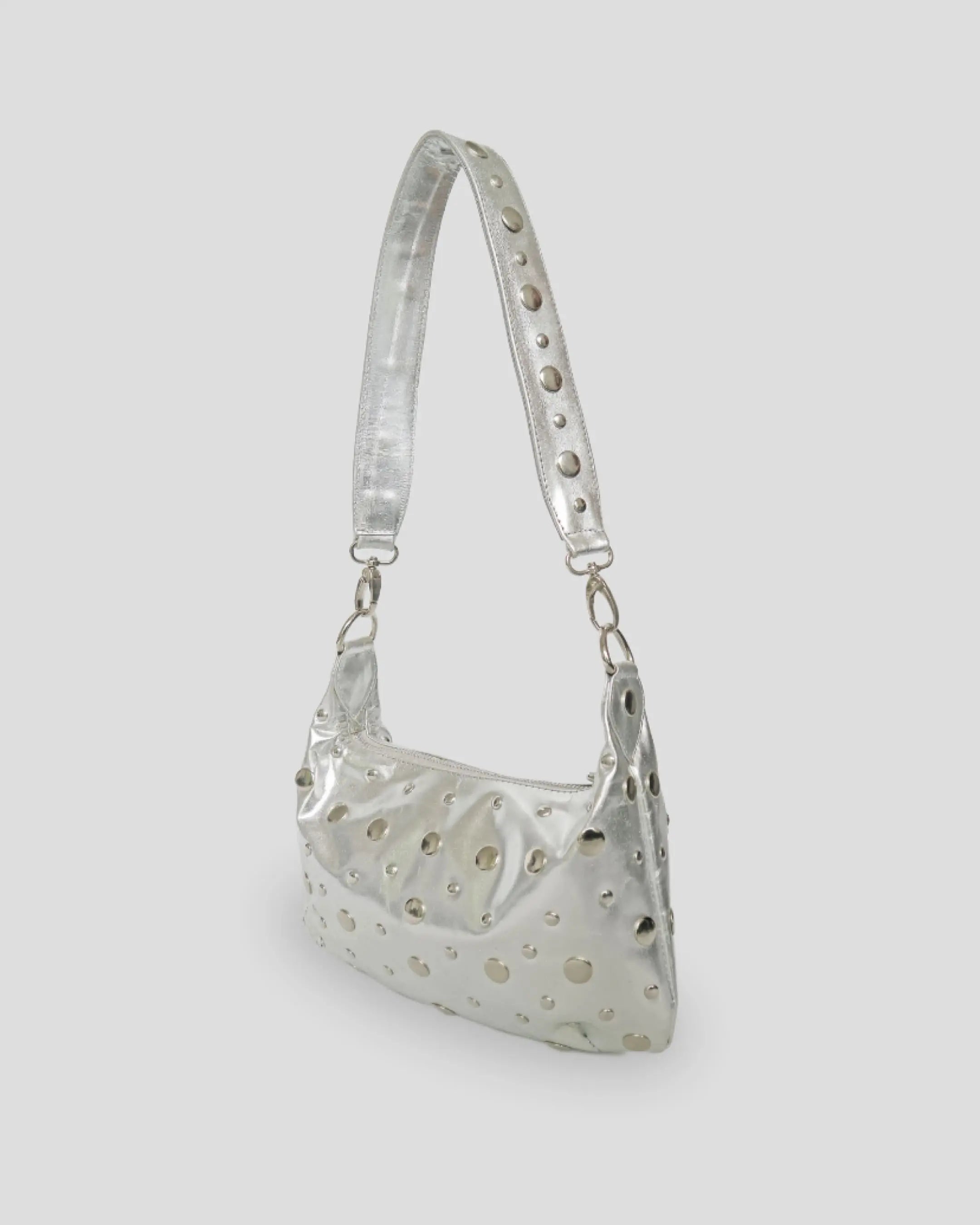 Silver shoulder bag for women side view showing studded leather texture and strap detail